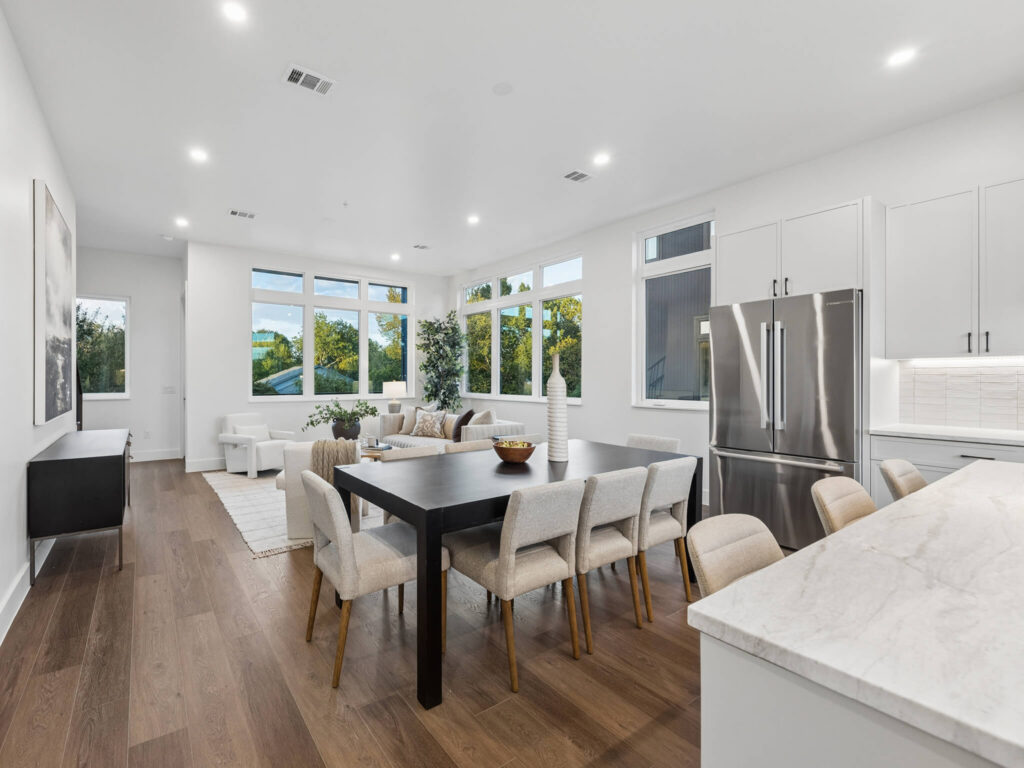 Interior view of the open-plan living room from the dining area at 4101 Menchaca Road, Austin, TX 78704