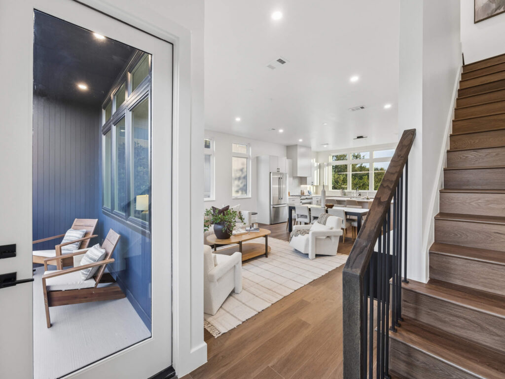 Interior view of the open-plan living room taken from the entryway at 4101 Menchaca Road, Austin, TX 78704