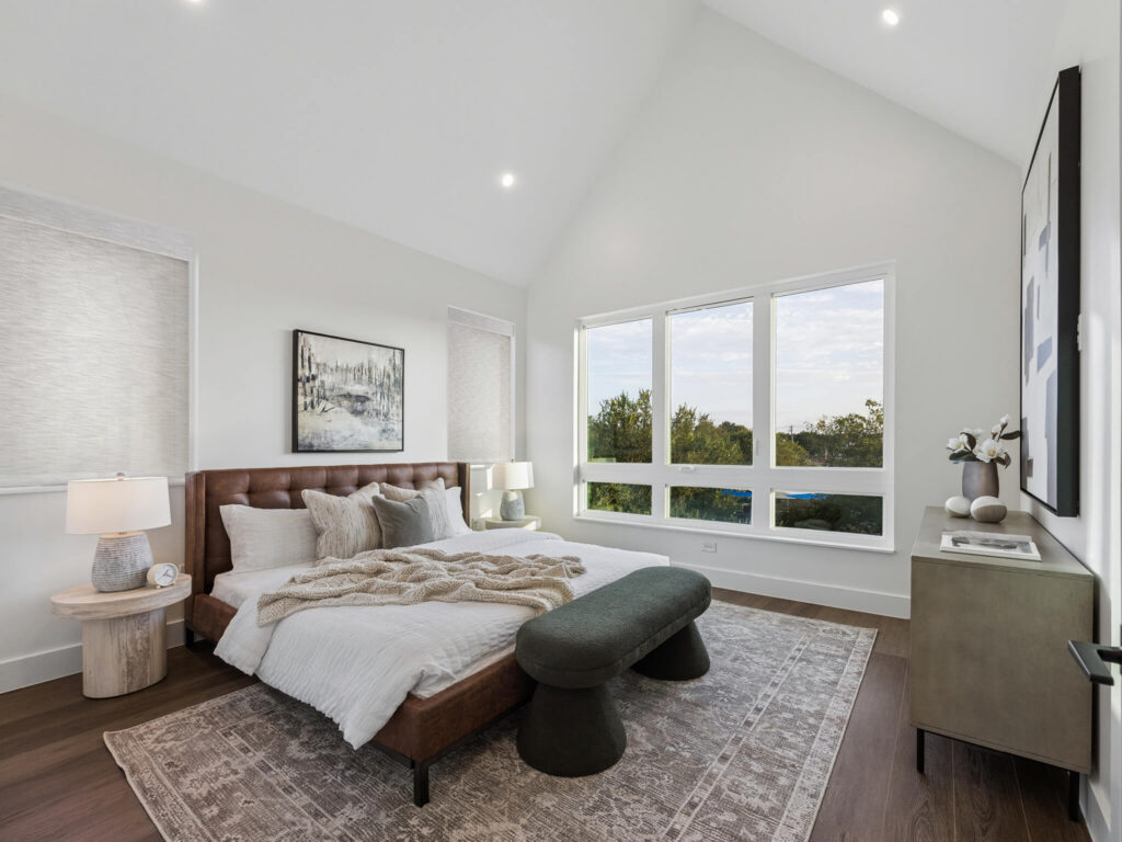 Interior view of modern townhome bedroom with large window at 4101 Menchaca Road, Austin, TX 78704