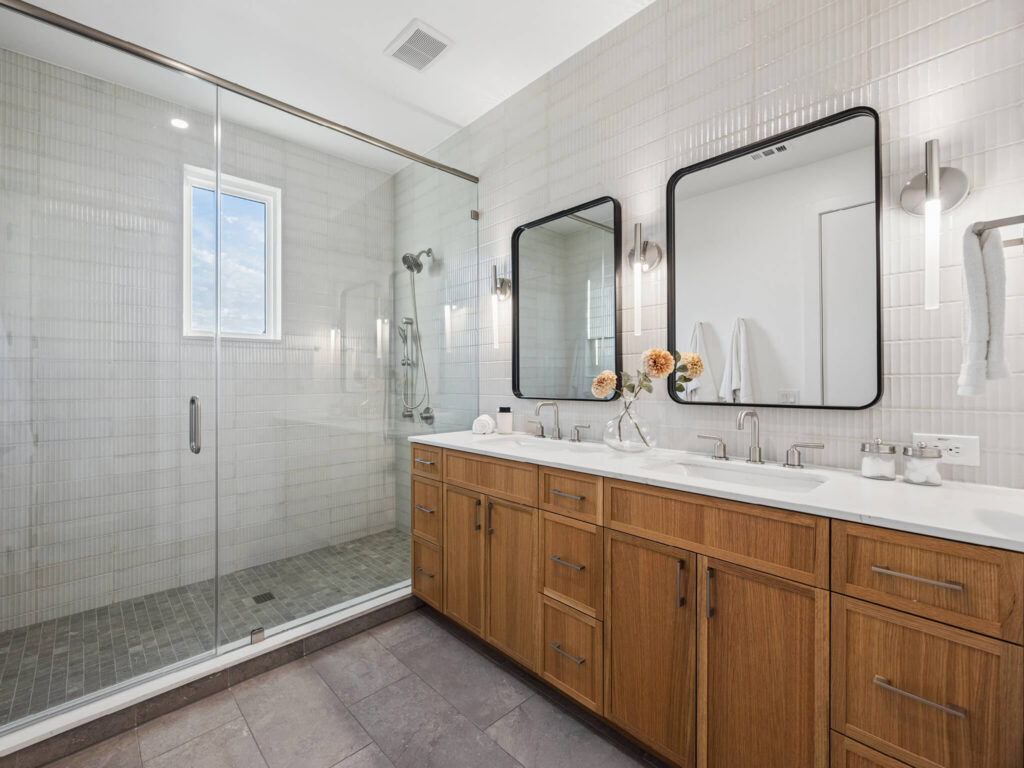 Interior view of modern townhome bathroom with tiled shower at 4101 Menchaca Road, Austin, TX 78704