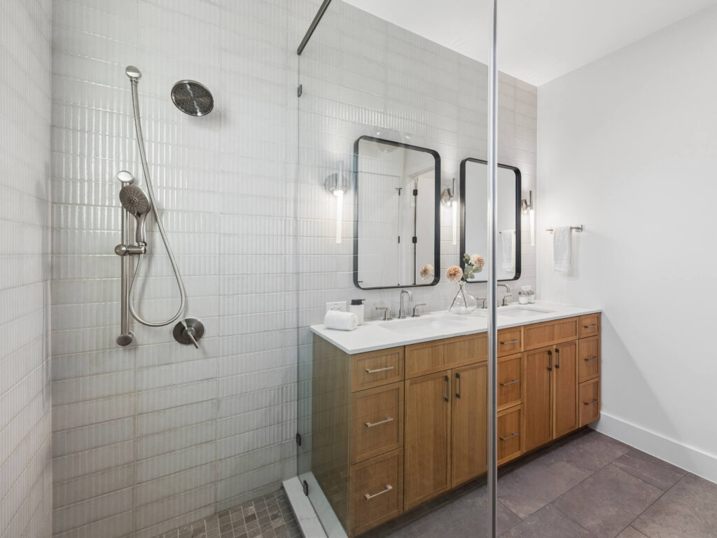 Interior view of modern townhome bathroom from tiled shower at 4101 Menchaca Road, Austin, TX 78704