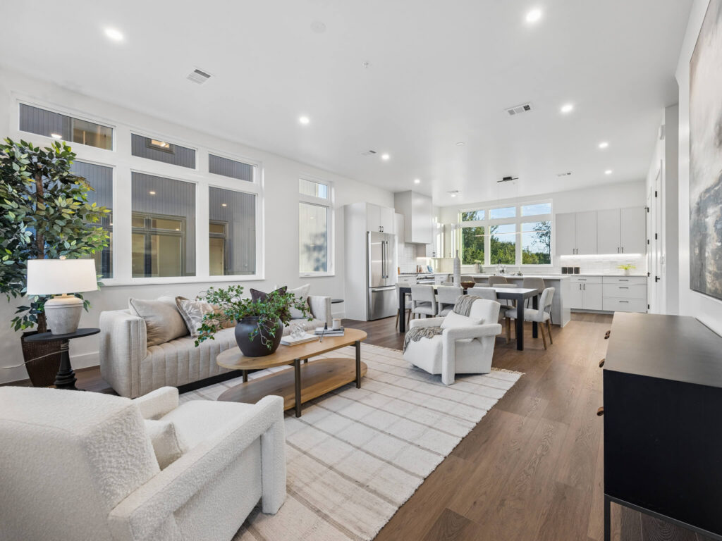 Interior view of the open-plan living room and kitchen at 4101 Menchaca Road, Austin, TX 78704