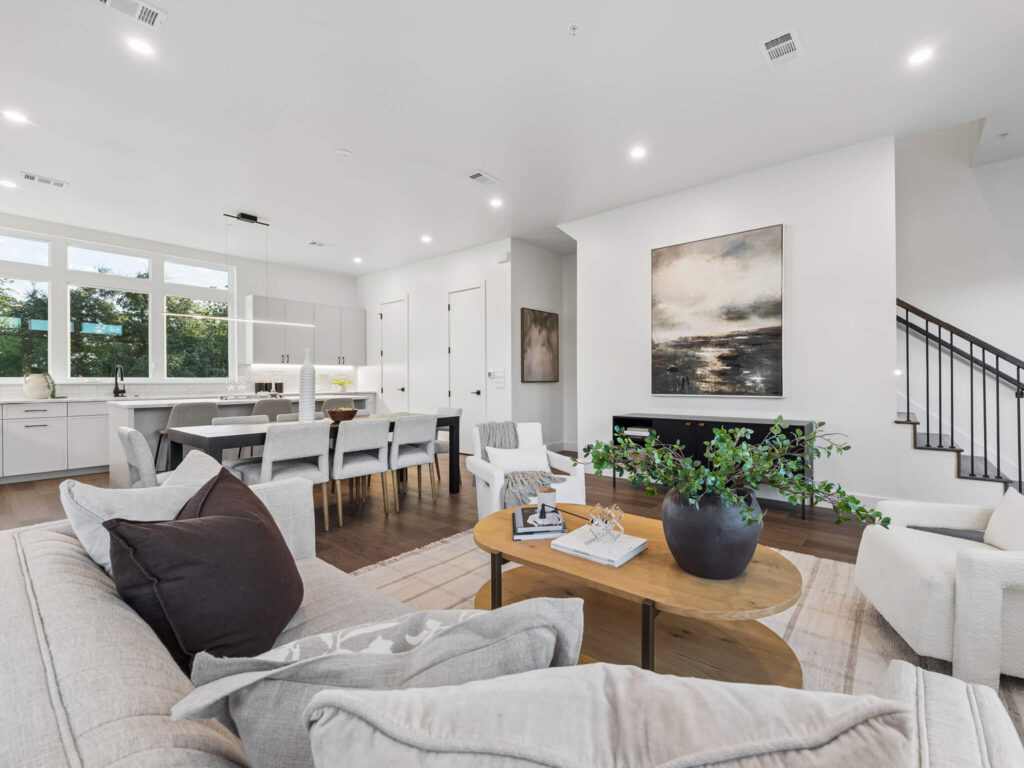 Interior view of the open-plan living room and kitchen at 4101 Menchaca Road, Austin, TX 78704