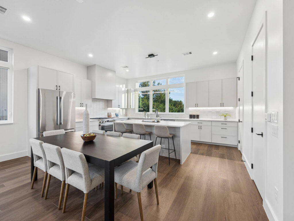 Interior view of the open-plan dining room and kitchen at 4101 Menchaca Road, Austin, TX 78704
