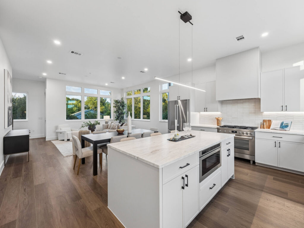 Interior view of the open-plan living room from the kitchen at 4101 Menchaca Road, Austin, TX 78704