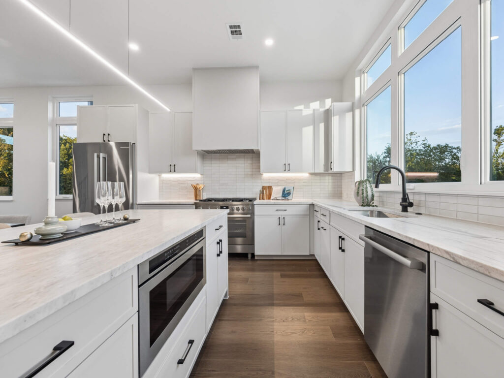 Modern light-filled kitchen interior with island at 4101 Menchaca Road, Austin, TX 78704